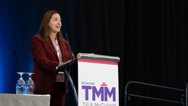 Woman speaking at podium