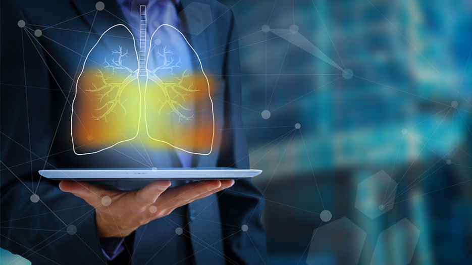 Illustration of a person holding a tablet with a projected digital set of lungs.