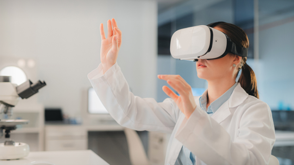 Woman in a lab coat is wearing a virtual reality device over her eyes