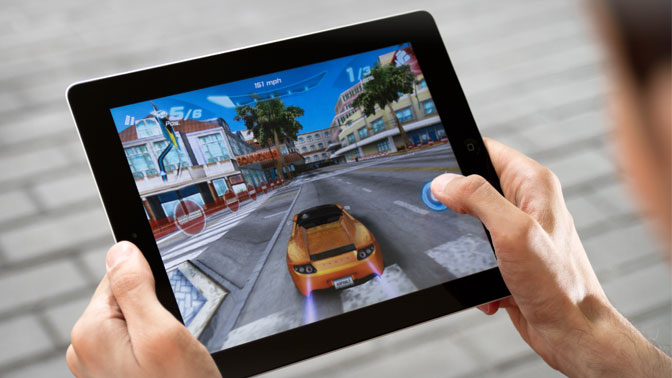 First-person video games, such as driving games, can cause visually induced motion sickness. Adding music to these games and virtual experiences can improve the user's well-being.