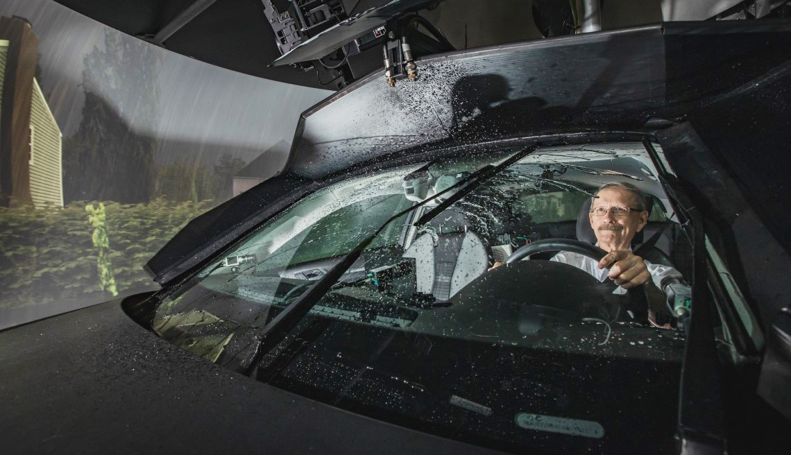 The DriverLab simulator contains a full-sized vehicle mounted on a hydraulic system. A dome of screens, high-resolution projectors and one-of-a-kind rain and glare simulators allow for an immersive driving experience. Photo credit: KITE.