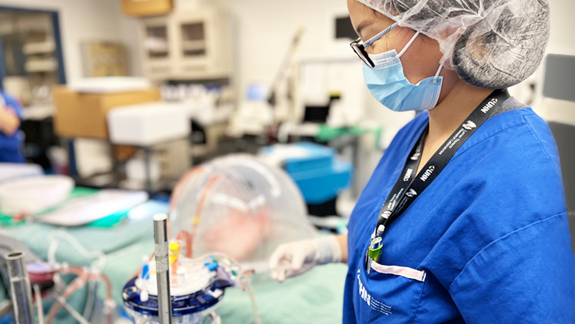At Dr. Marcelo Cypel's laboratory, Dr. Aizhou Wang (pictured) demonstrates how the cocktail of enzymes that were used in this study are delivered to a donor lung using the Ex Vivo Lung Perfusion system.