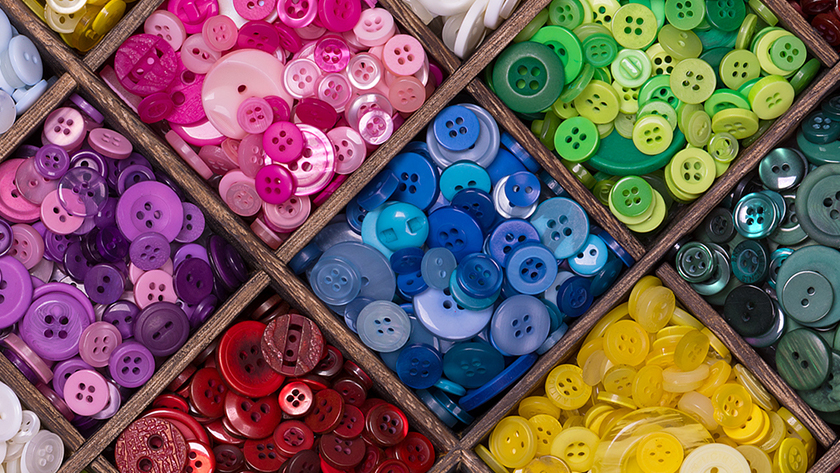 The identification of macrophage subsets in this study represents a new approach to categorizing cells by their similarities, just like how these buttons have been sorted by colour despite having different shapes and sizes.