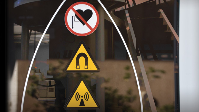 NMR spectrometry used by the researchers in this study relies on incredibly strong magnets. The magnets are so strong that a perimeter must be drawn several feet from the NMR machine in which magnetic materials, such as certain metals, medical implants an