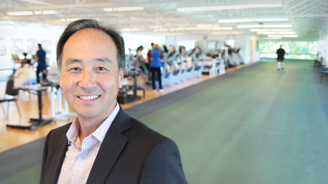 Dr. Paul Oh on the 200 metre indoor track at Toronto Rehab's Rumsey Centre.